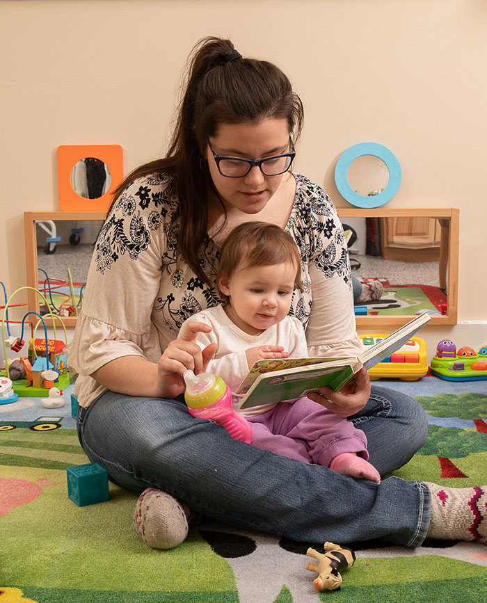 Teacher-and-baby-reading-NEKLS-learning-services-and-educational-support